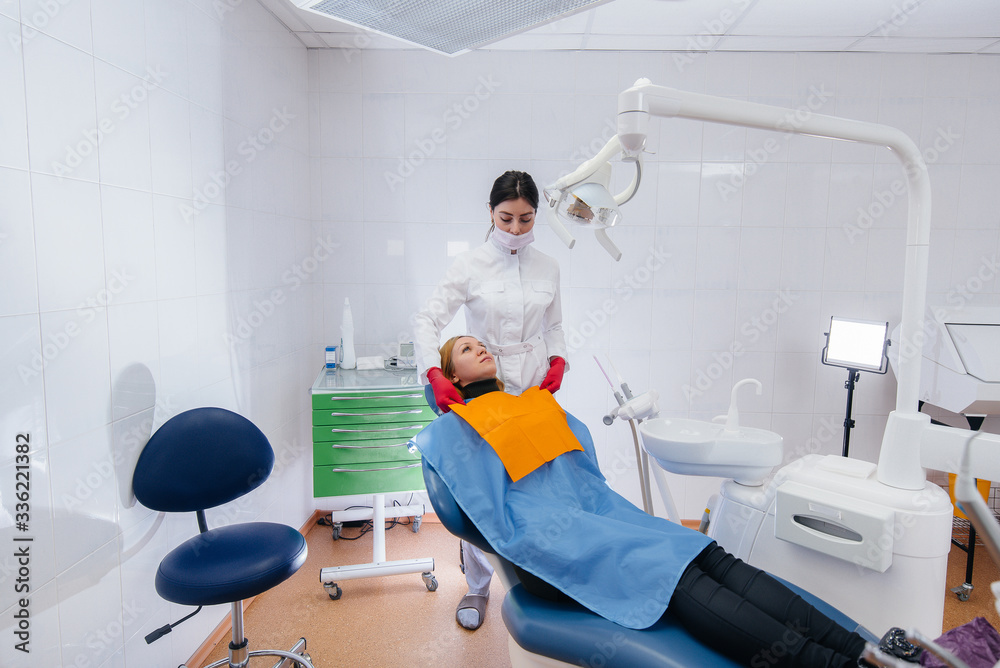 The dentist conducts an examination and consultation of the patient. Dentistry The dentist conducts an examination and consultation of the patient. Dentistry