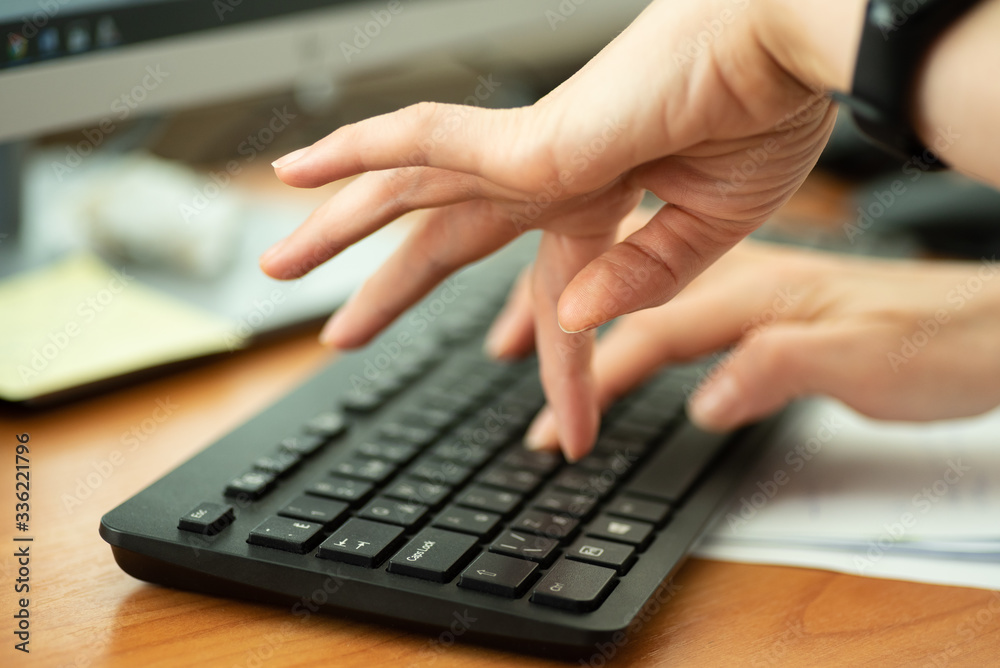 Woman typing text on keyboard, close up Woman typing text on keyboard, close up