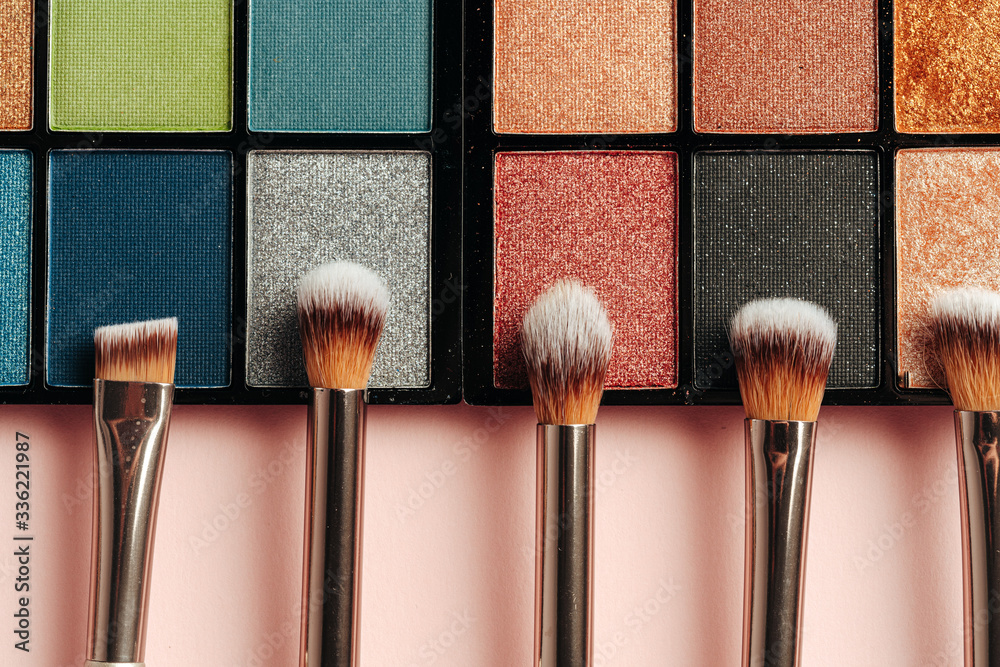 Make-up palette and brushes. Professional eyeshadow palette. Close up. - obrazy, fototapety, plakaty 