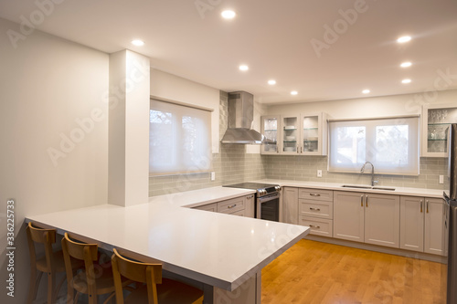 New and Modern Open Concept Kitchen with a Grey and White Color Scheme