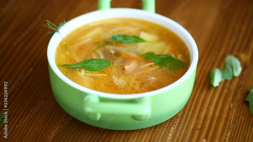 baked meat with spices vegetables and gravy in a ceramic form, on a wooden table baked meat with spices vegetables and gravy in a ceramic form, on a wooden table