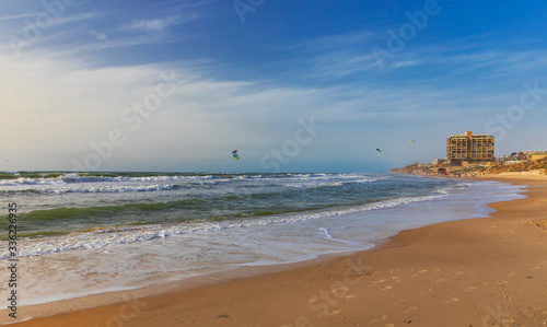 Surfers ride the waves on t...
