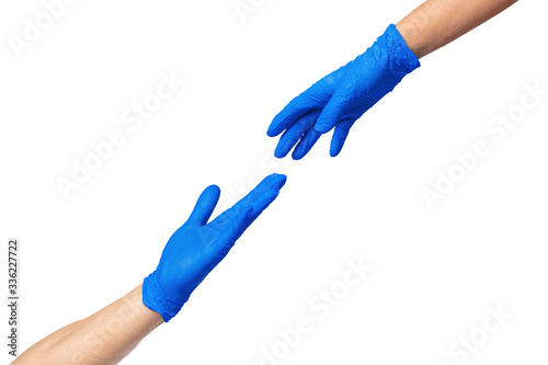 Male and female hands in medical gloves stretch to each other. Help concept. Close up