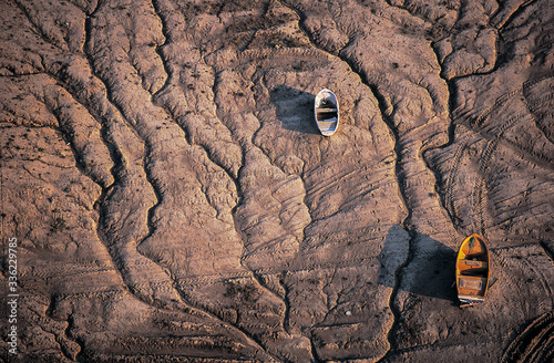 Wooden boat on dry lake