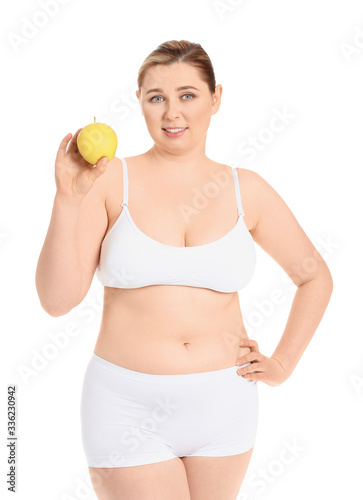 Overweight woman with apple on white background. Weight loss concept