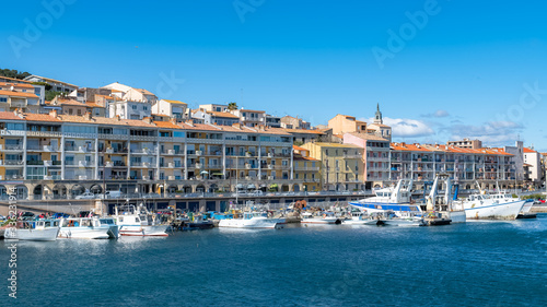 Sète in France, traditional boats moored at the quay in the city centre 