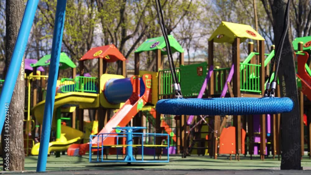 Empty playground with colorful swings and slides during covid19 quarantine