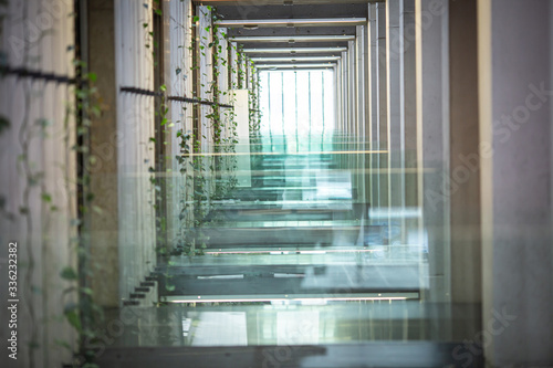 Concrete wall with glass inserts as a balustrade and decorative element.