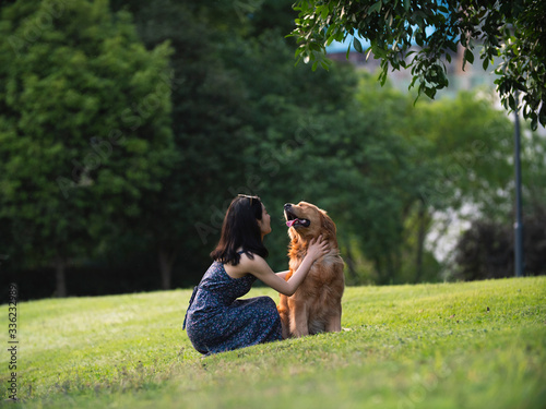 young Asian woman with dog outdoor