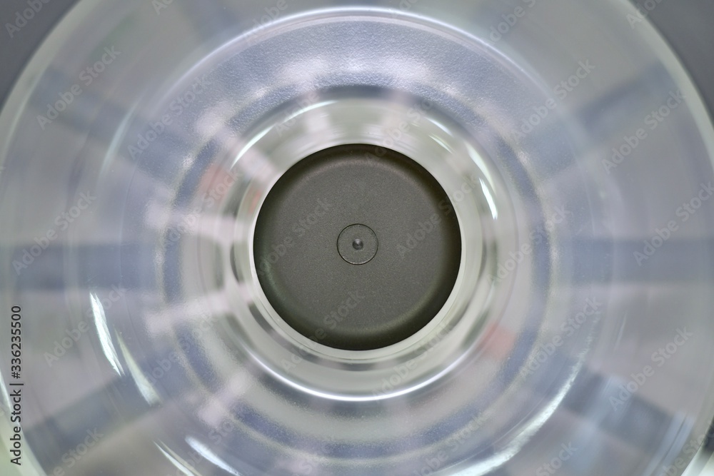 Closed laboratory centrifuge with highly rotating tube compartments. View from above. Closed laboratory centrifuge with highly rotating tube compartments. View from above.
