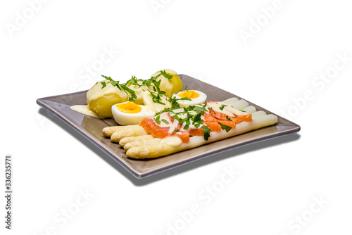 Delicious seasonal white asparagus with baby boiled potatoes and smokes salmon
