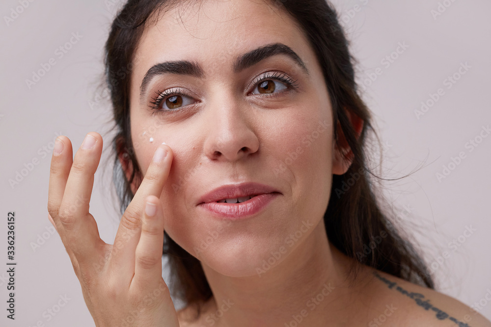 Skin hydrated natural woman smiling portrait - fresh skincare portrait - gentle face touching Skin hydrated natural woman smiling portrait - fresh skincare portrait - gentle face touching