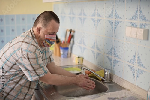 man with down syndrome washing hands
