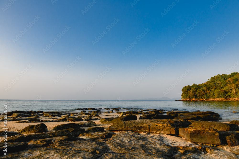 Landscape of stones, shallow sea and sky