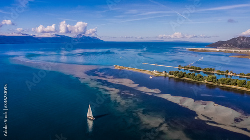 Aerial view of sailing boat at Neretva river mouth in Dalmatia, Croatia. photo