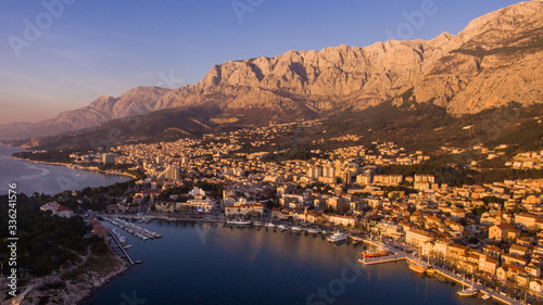 Aerial view of the sunset at the city of Makarska in Dalmatia, Croatia. photo