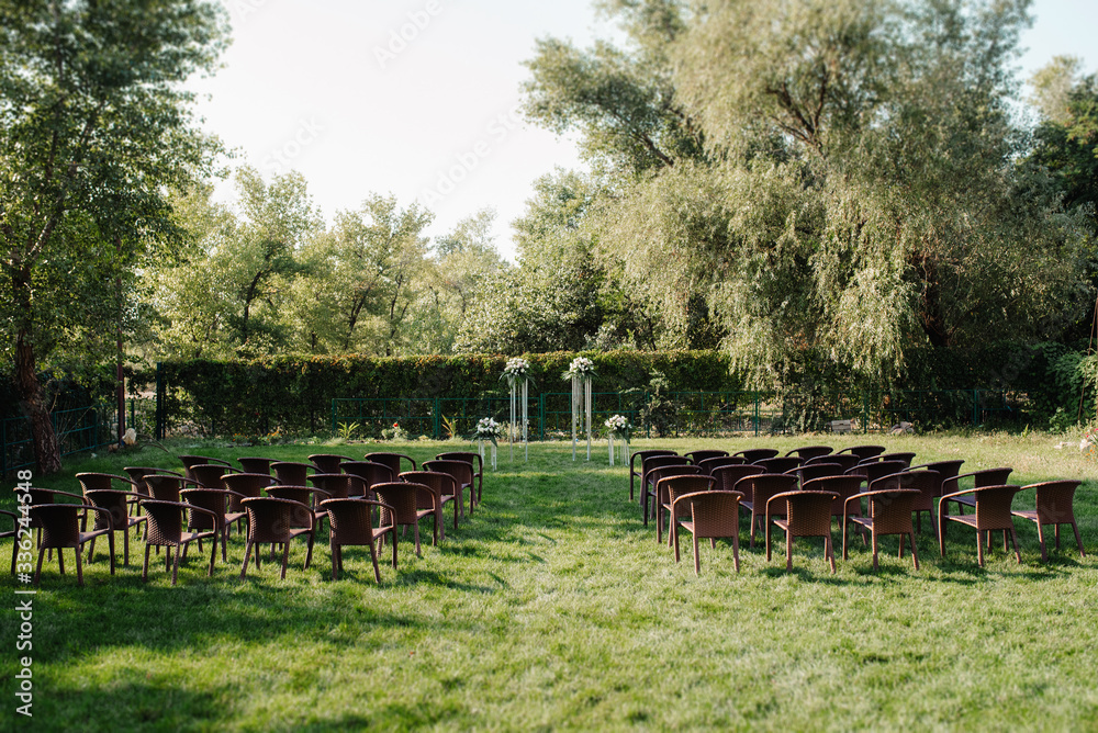 wedding ceremony in the woods among the trees on the green track