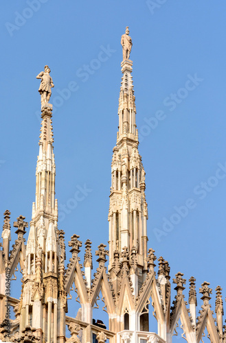 Cathedral of the Nativity of the Virgin Mary in Milan. Cathedral of white marble. The Late Gothic building contains many spiers and sculptures  marble peaked towers and columns.