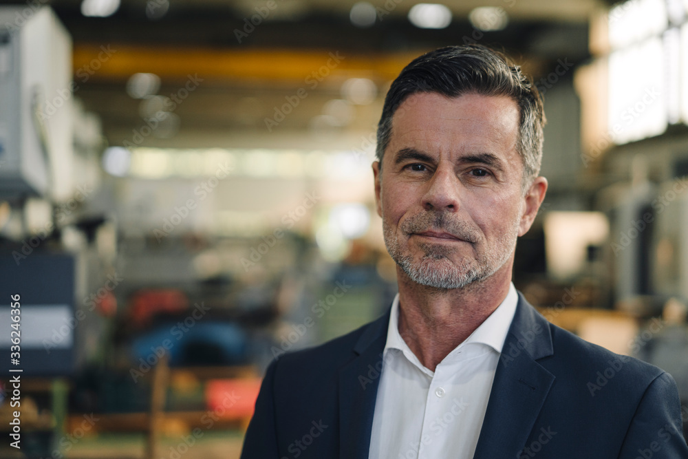 Portrait of a confident businessman in a factory Portrait of a confident businessman in a factory