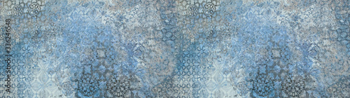 Old gray blue vintage shabby patchwork motif tiles stone concrete cement wall texture background banner	
