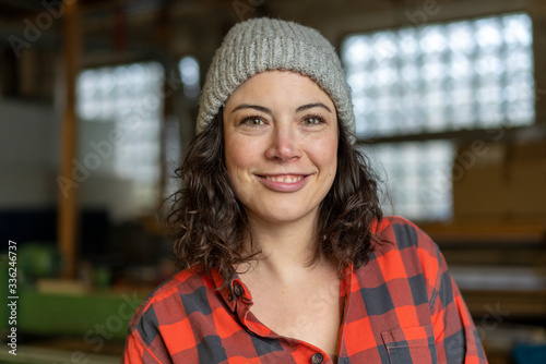 Portrait of confident craftswoman in her workshop photo