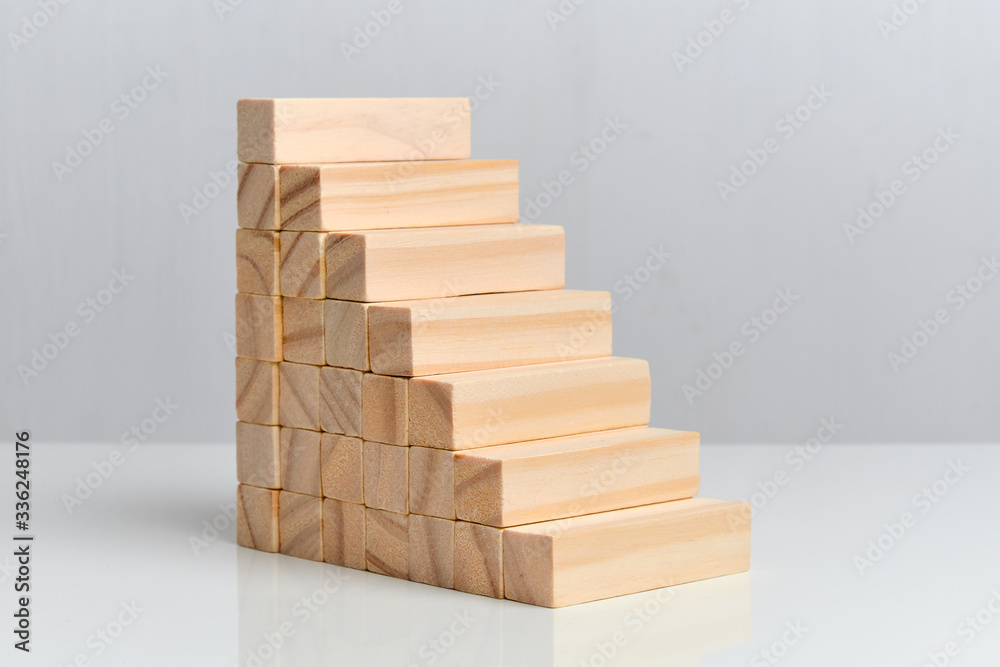 Wooden blocks in the form of a ladder on a white background background. Wooden blocks in the form of a ladder on a white background background.