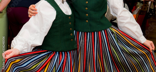 Children posing in folk dance outfits
