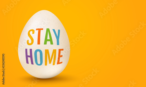 White egg for Easter with text stay home
