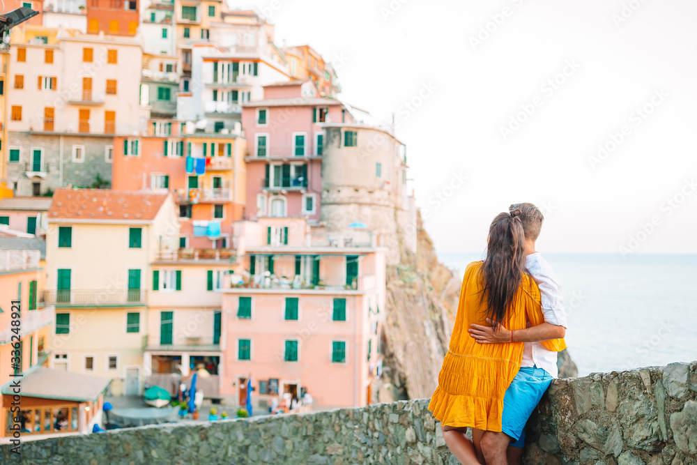 Happy family with view of the old european village in Cinque Terre