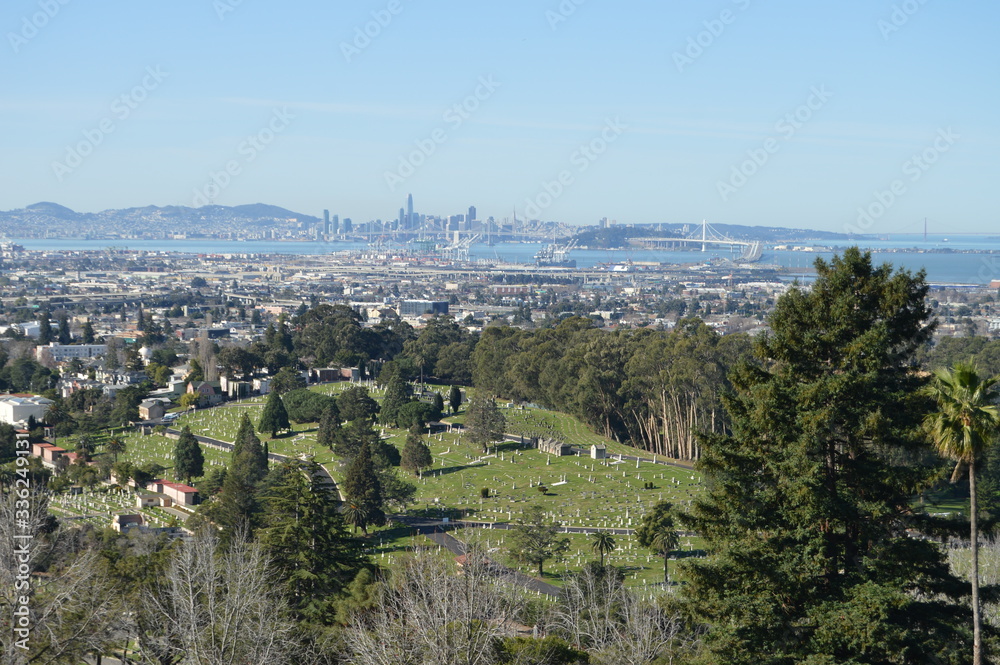 Panoramic view over Oakland, San Francisco Bay and the City of San Francisco from the top of St. Mary Cemetery in Oakland.