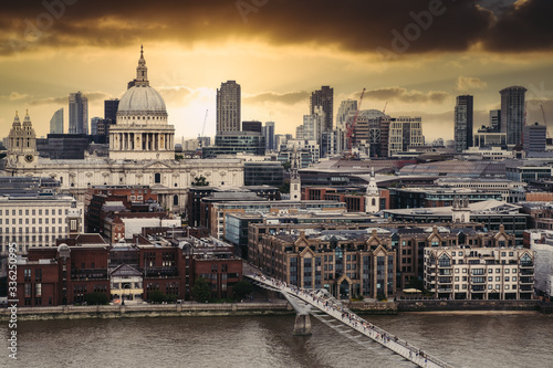 Aerial view of London at sunset with St Paul Cathedral at sunset