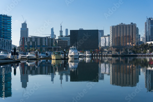 Docklands cityscape with marina, yachts and skyscrapers