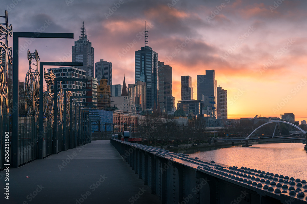 Melbourne cityscape at sunrise with Melbourne CBD skyscrapers and Southbank