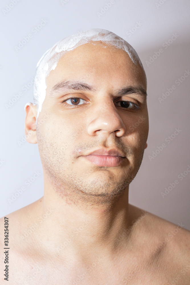 Man Shaving His Head Using White Foam Man Shaving His Head Using White Foam
