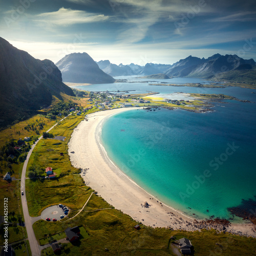 Aerial view of Ramberg beach, Flakstad, Lofoten, Nordland, Norway with the mountains, white sand and turquoise water photo