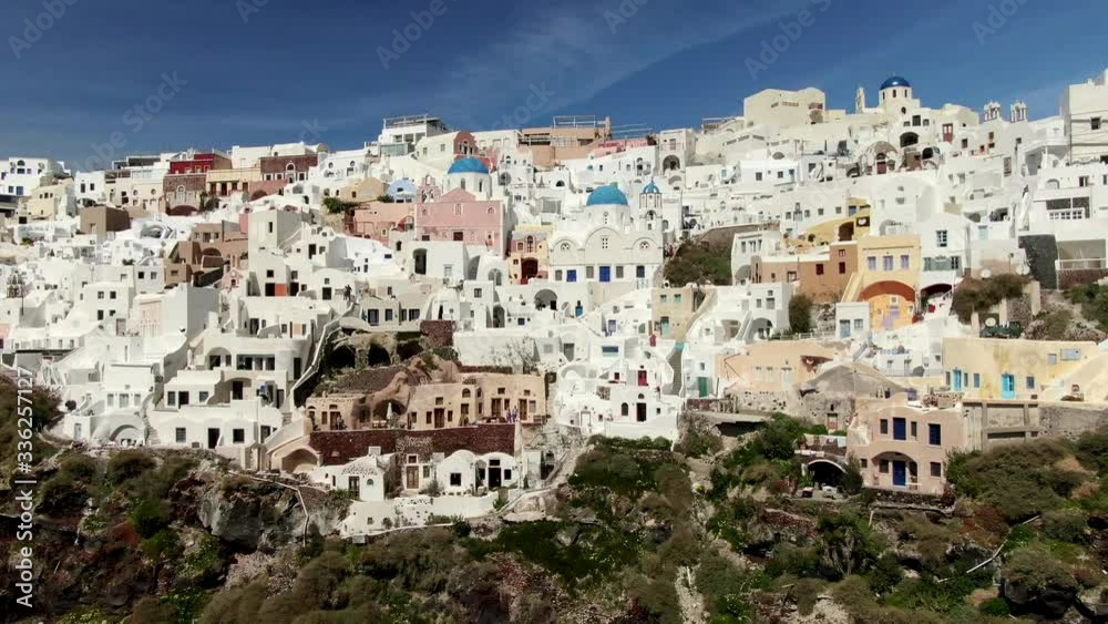 Aerial Above White Houses Beautiful view of Churches in Oia village, Santorini island in Greece Aerial Above White Houses Beautiful view of Churches in Oia village, Santorini island in Greece