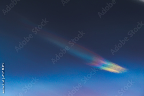 Nacreous cloud in dusk on a blue sky