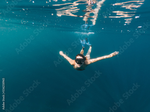 Young woman snorkeling in sea © BullRun