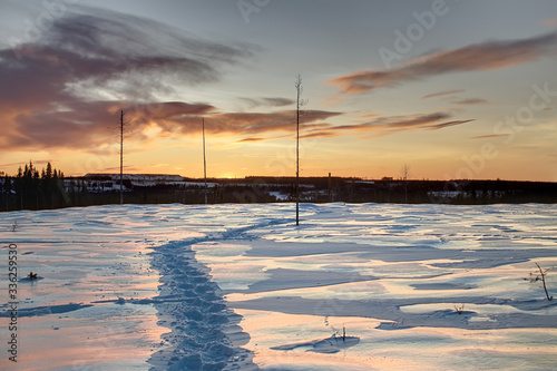 HDR shot of winter dusk in Swedish Lapland, with breakable crust on the snow photo