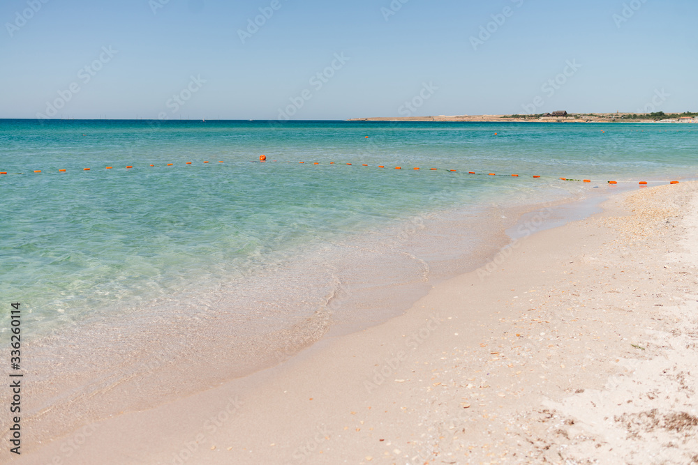 Wonderful landscape of turquoise sea and white sand. Sea with safe buoys. Holiday and honeymoon concept. Wonderful landscape of turquoise sea and white sand. Sea with safe buoys. Holiday and honeymoon concept.