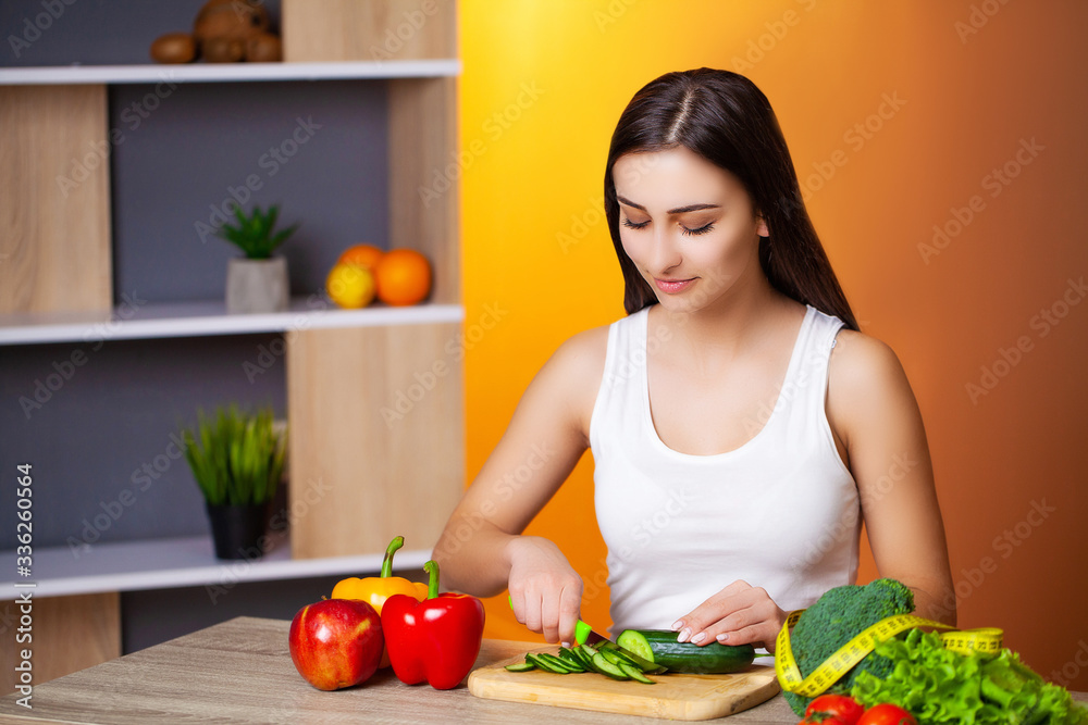Cute woman with fresh vegetables and fruits leading a healthy lifestyle