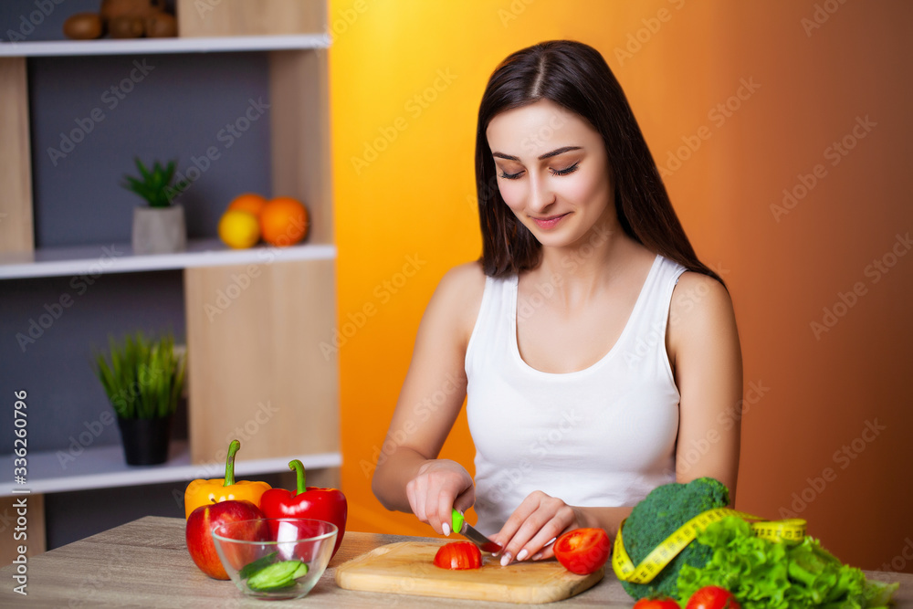 Cute woman adheres to her diet and eats only fresh vegetables and fruits Cute woman adheres to her diet and eats only fresh vegetables and fruits
