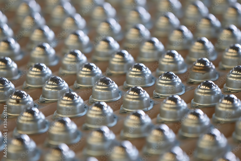 Many ball bearings arranged neatly Many ball bearings arranged neatly