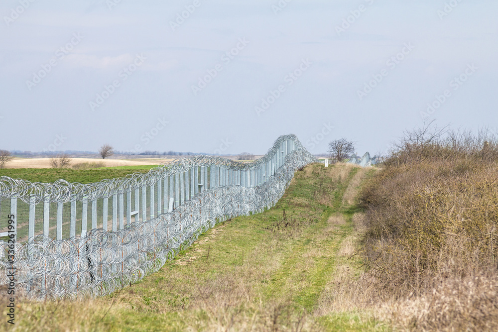 Border fence between Rastina (Serbia) & Bacsszentgyorgy (Hungary). This border wall was built in 2015 to stop the incoming refugees & migrants during the refugees crisis, on Balkans Route.