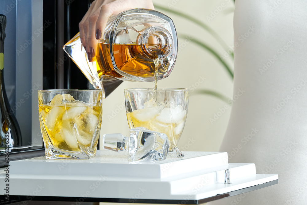 open hatch of a mini bar in a modern refrigerator. home mini bar in the