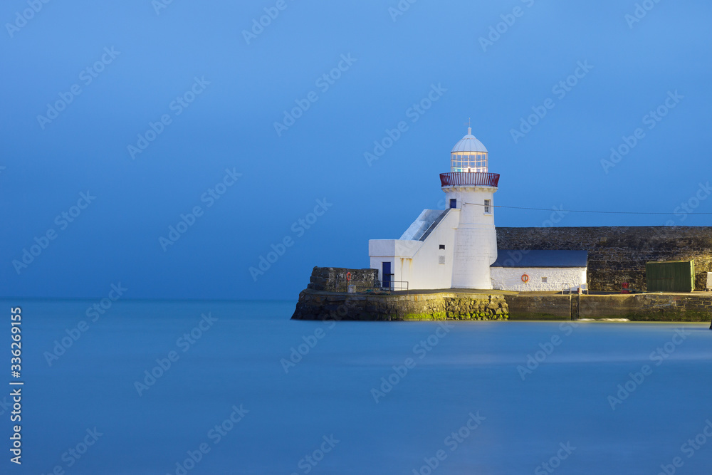 Lighthouse in Balbriggan, Ireland calm water, long exposure blue hour