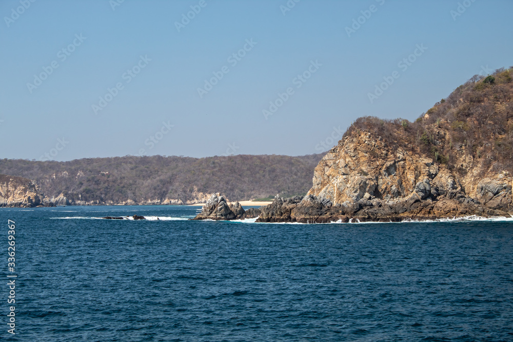 Turquoise ocean a sunny day in huatulco mexico