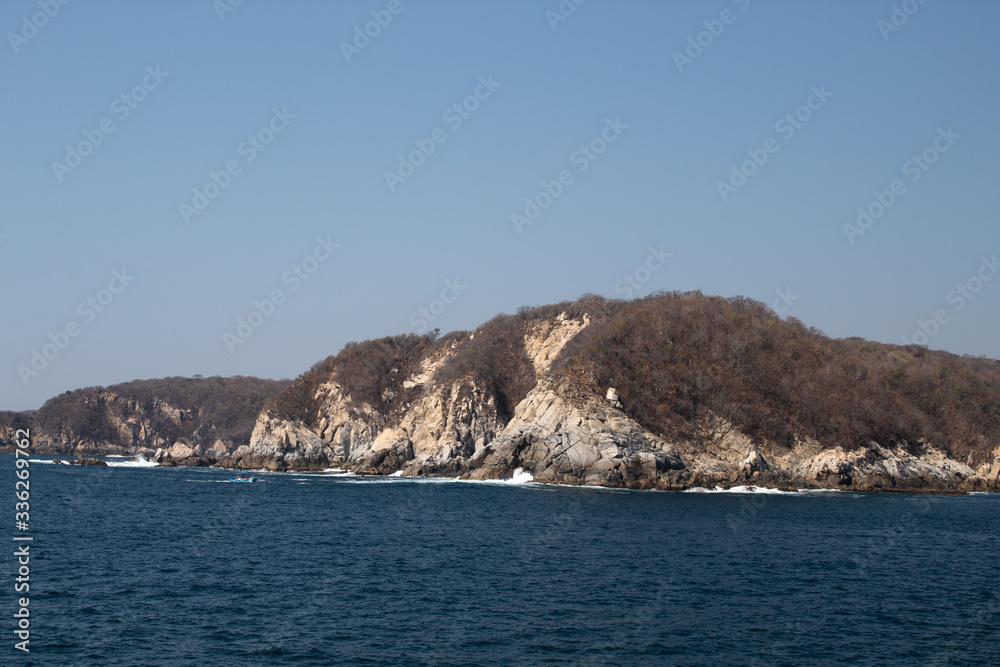 Huatulco bay with blue ocean