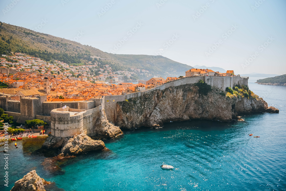 Old medieval Mediterranean city walls and bay of the sea