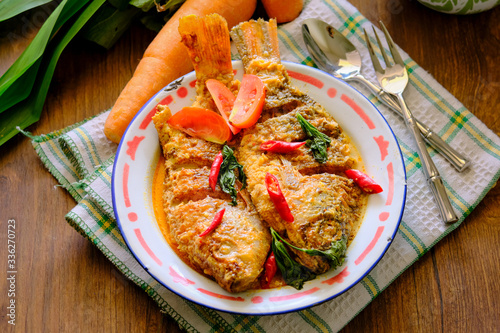 Mangut nila is traditional food from indonesia. Made from fried fish mixed with spicy coconut curry sauce
